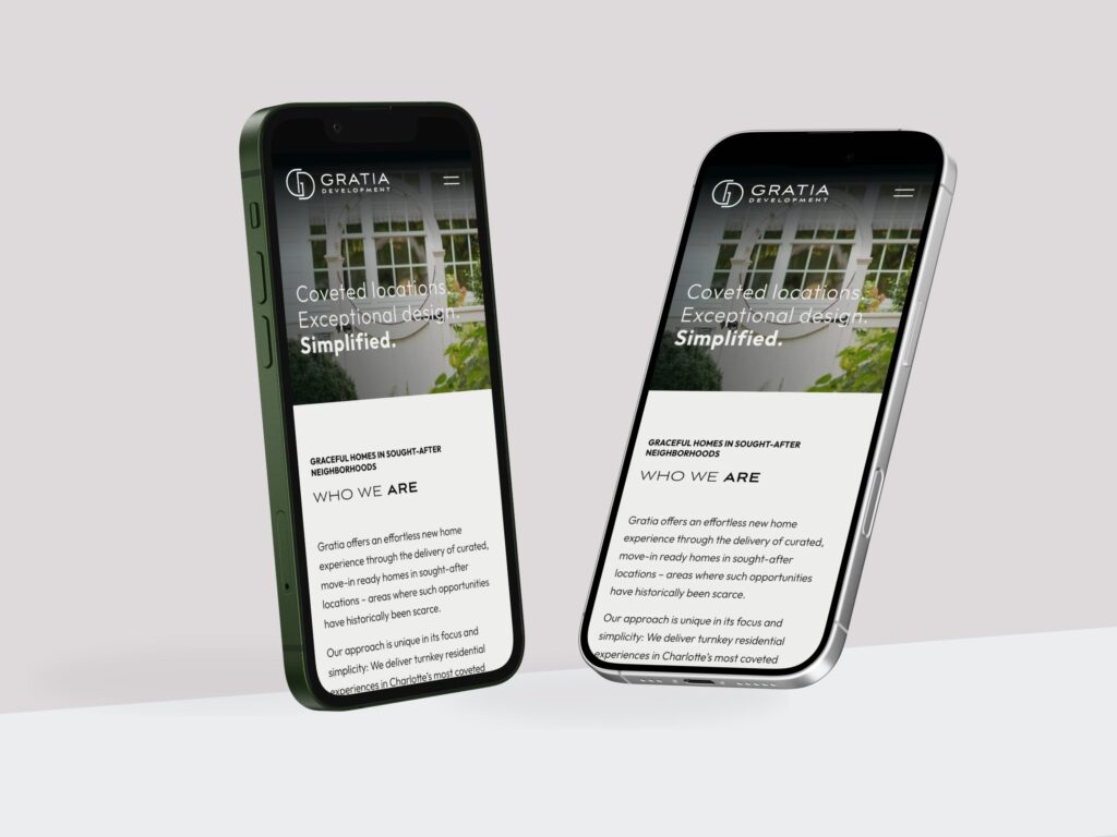 Two smartphones displaying real estate website design