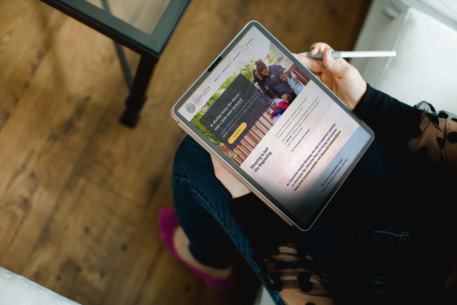 MJC Web Designer using tablet to browse newly launched website