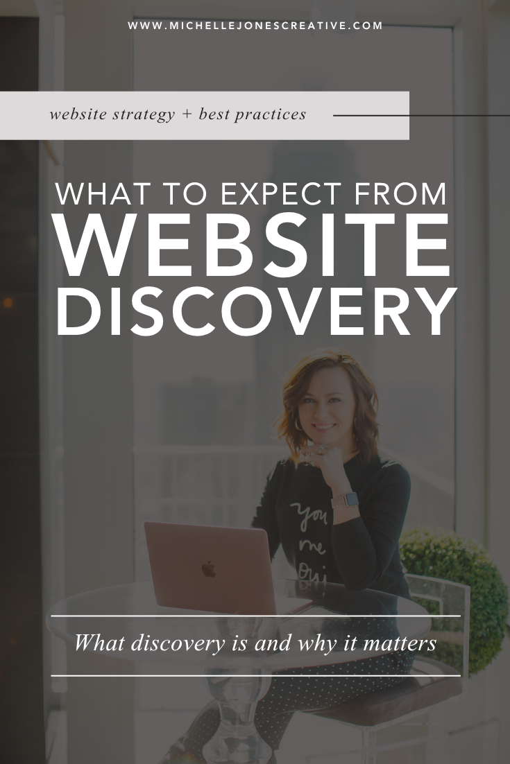 Female web designer with laptop explaining website discovery process